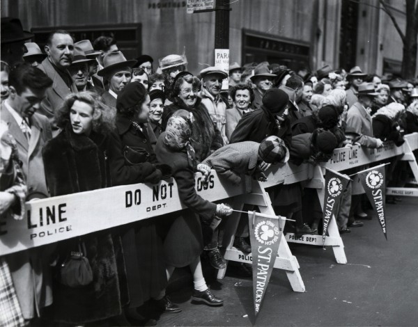 A crowd at the police barricades, waiting for the St. Patrick’s Day Parade in New York City, 1951
