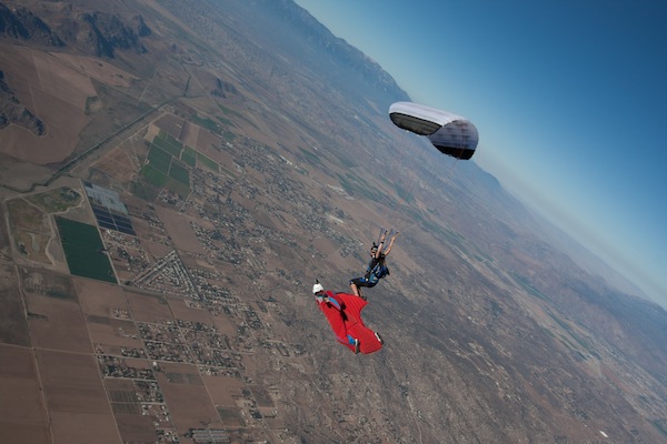 Flying with high-performance canopy pilot Jessica Edgeington in a discipline the author pioneered called XRW (“Extreme Relative Work”). Advances in skill and technology have allowed a wingsuit flyer in freefall to match speeds with a pilot under a fully open parachute.