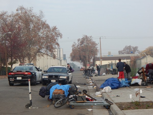 Since encampments were banned in Fresno, tents cannot be permanent. In the morning, police make sure those whose who spent the night on the streets pack everything up. 