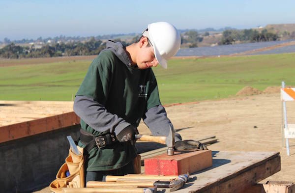 Daniel Lopez builds Transitional Houses on campus as part of the Construction Academy.