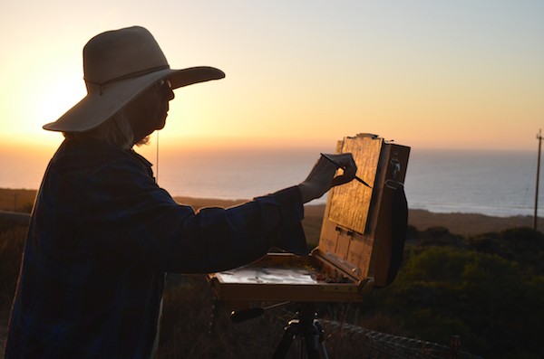 The author painting by the ocean