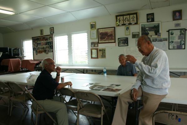 Talking Story with elders in the Piihonua Kaikan (community center) on the former Piihonua Sugar Plantation, Hawaii. 
