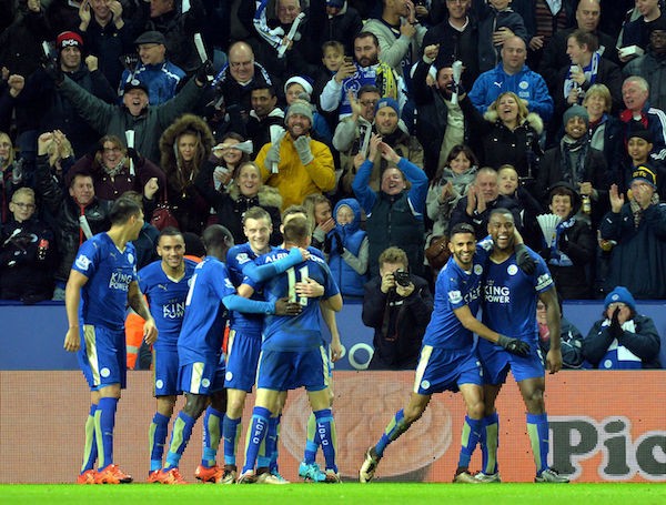 Leicester City Football Club players celebrate after striker Jamie Vardy scores an opening goal against Premier League powerhouse Chelsea Football Club.