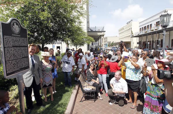 The crowd gathers for photos of the Juneteenth historical marker in Galveston, Texas in 2014. It was placed at the site of where the Osterman Building, the Union Army headquarters, once stood.