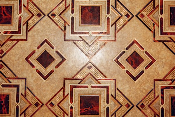 Linoleum floor with brown geometric pattern. 