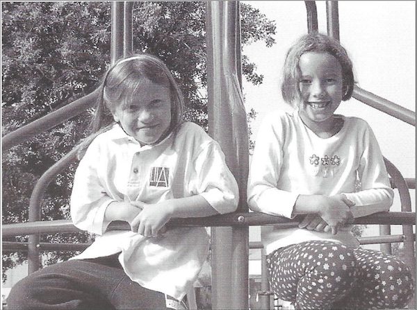 Jones (left) wearing a LILA t-shirt with a friend.