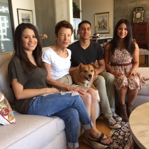 Billie, second from the left, with neighbors and dog in her apartment. 