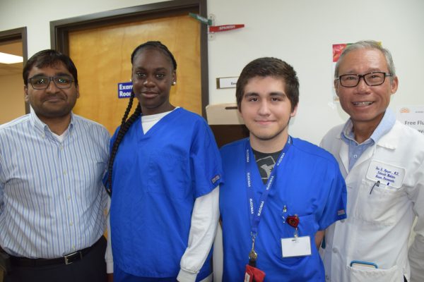 From left to right: Al-Shifa manager Muhammad Safwatullah, Job Corps interns Alex Acuna and Keviana Mims, and Dr. Duc Nguyen at Al-Shifa Free Health Clinic.