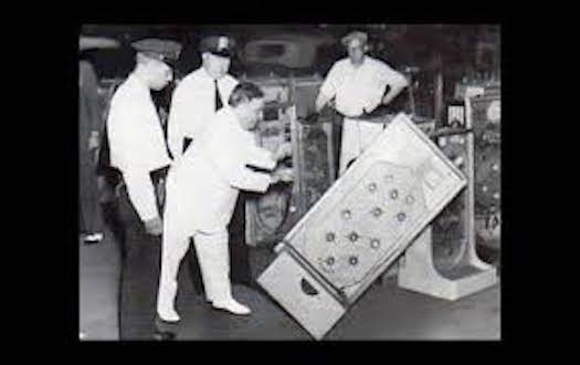 LaGuardia pushing over the Bally's Bumper pinball machine.