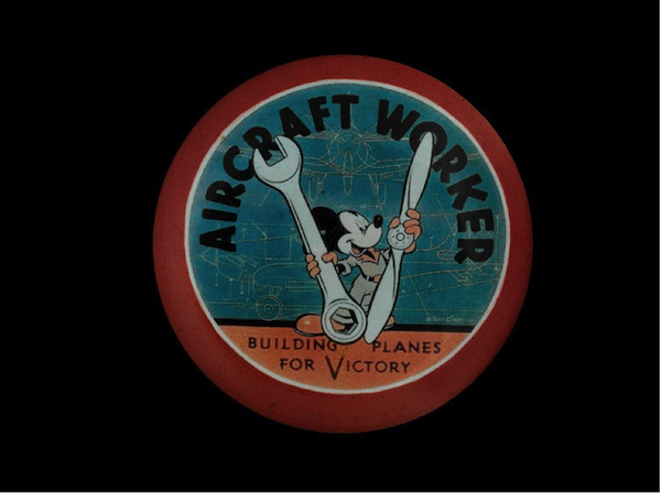 WWII aircraft worker’s pin featuring Mickey Mouse, from the Lockheed Martin Aircraft Plant in Burbank, CA.