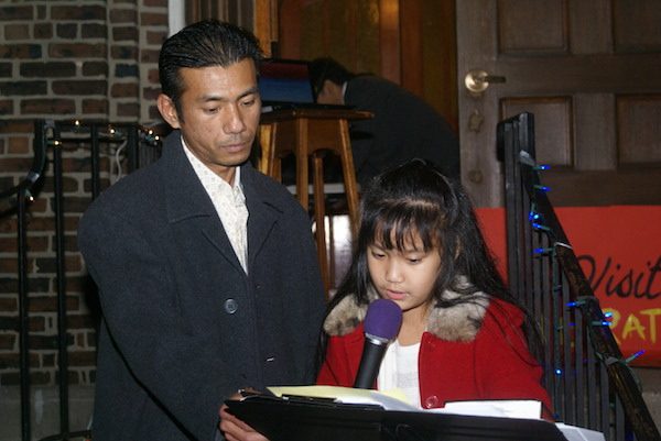 Harry Pangemanan, after 4 months in detention and many months in sanctuary, with his daughter Jocelyn on the steps of the Reformed Church of Highland Park. Courtesy of Reformed Church of Highland Park.
