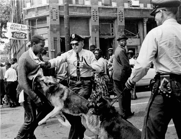 In this iconic image published in The New York Times on May 4, 1963, a 17-year-old high school student is attacked by a police dog in Birmingham, Ala.  Photo by Bill Hudson/Associated Press.