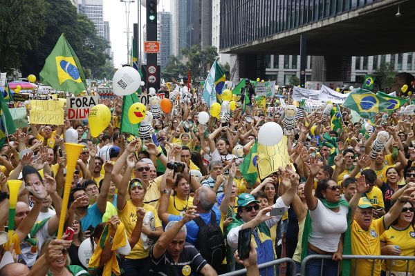 Demonstrators gather in São Paulo to demand the impeachment of Brazil's then-President Dilma Rousseff in March 2016. Rousseff was eventually toppled over alleged fiscal mismanagement. Photo by Andre Penner/Associated Press.
