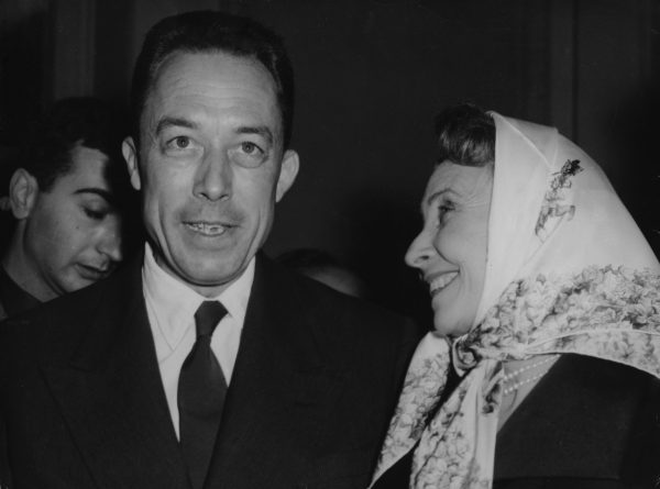 French actress Madeleine Renaud, right, congratulates French writer Albert Camus, after he was officially announced as winner of the Nobel Prize for literature, at the Gallimard book publishers in Paris, France, October 17, 1957. Photo by Godot/Associate Press. 