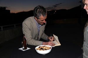 Geoff Dyer signs books at the reception