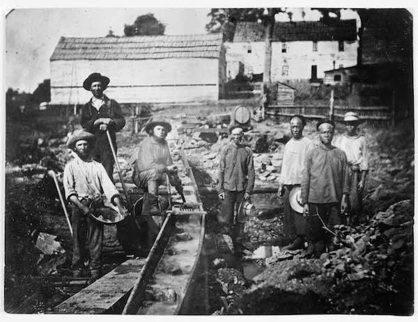 Chinese miners work alongside miners of other ethnicities in Auburn, California, circa 1852. Fortune-seekers from around the world migrated to northern California following the discovery of gold in 1848.