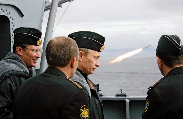 Wearing sailor's uniform Russian Defense Minister Sergei Ivanov, left, and President Vladimir Putin, third from left, watch a missile launch aboard the nuclear-powered misile cruiser Peter the Great, while observing naval maneuvers of Russia's Northern Fleet in the Barents Sea, Aug. 2005. Photo by Alexei Panov, ITAR-TASS, Presidential Press Service/Associated Press.