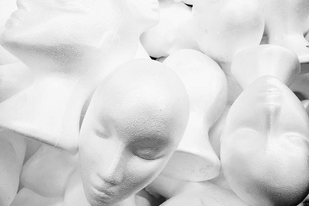 A pile of white styrofoam heads
